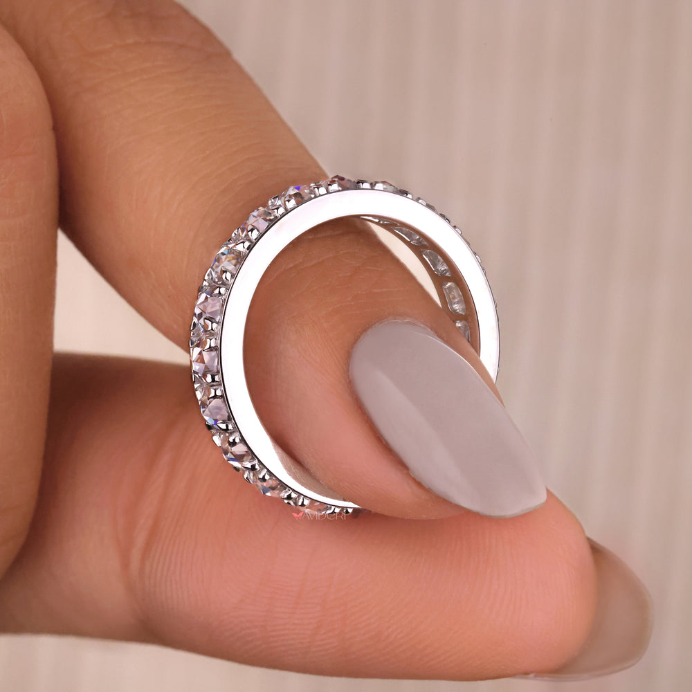 White gold diamond band in a delicate claw prong setting.
