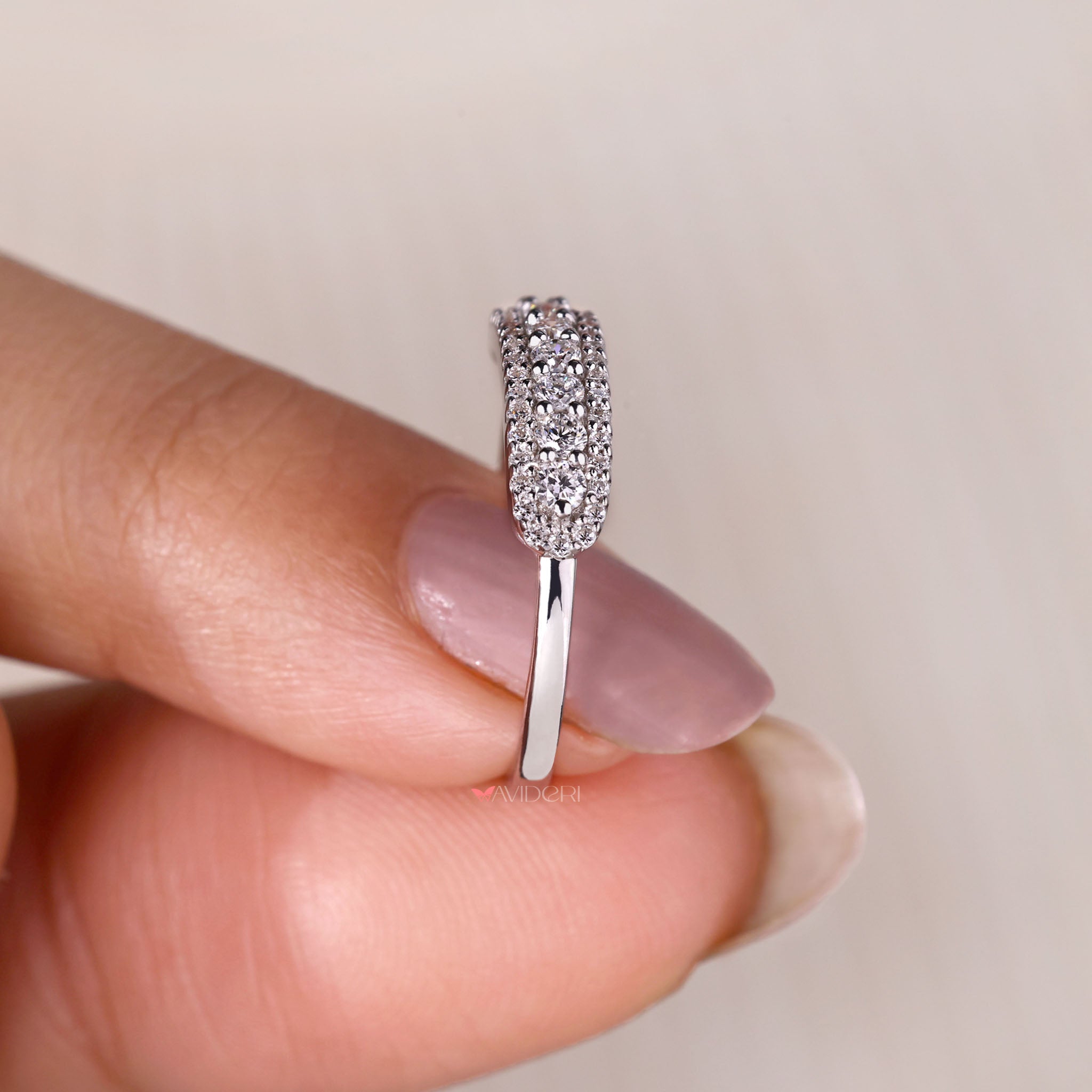 Three row pave diamond band handcrafted with precision.
