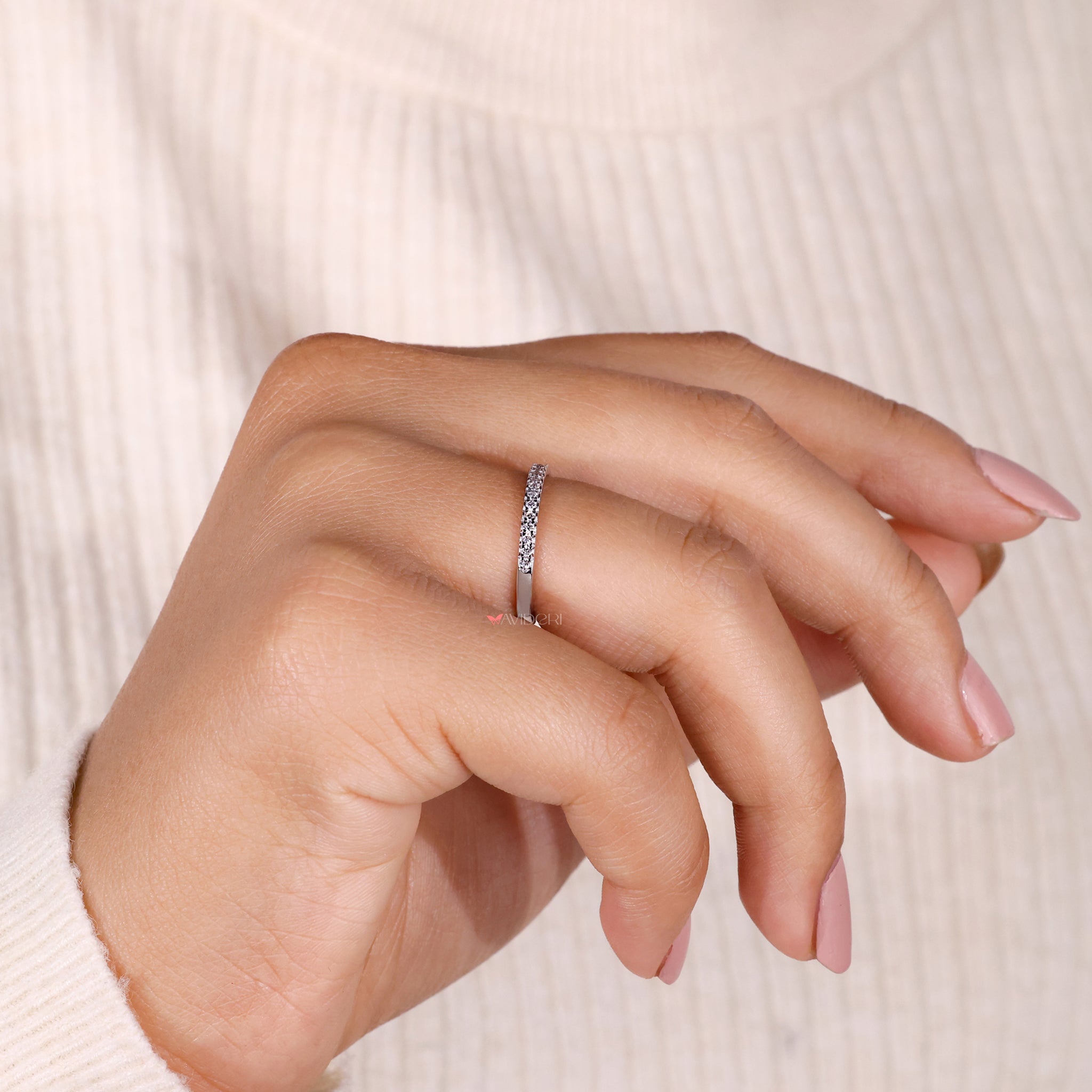 Simple wedding band with round cut diamonds, perfect for elegant brides.
