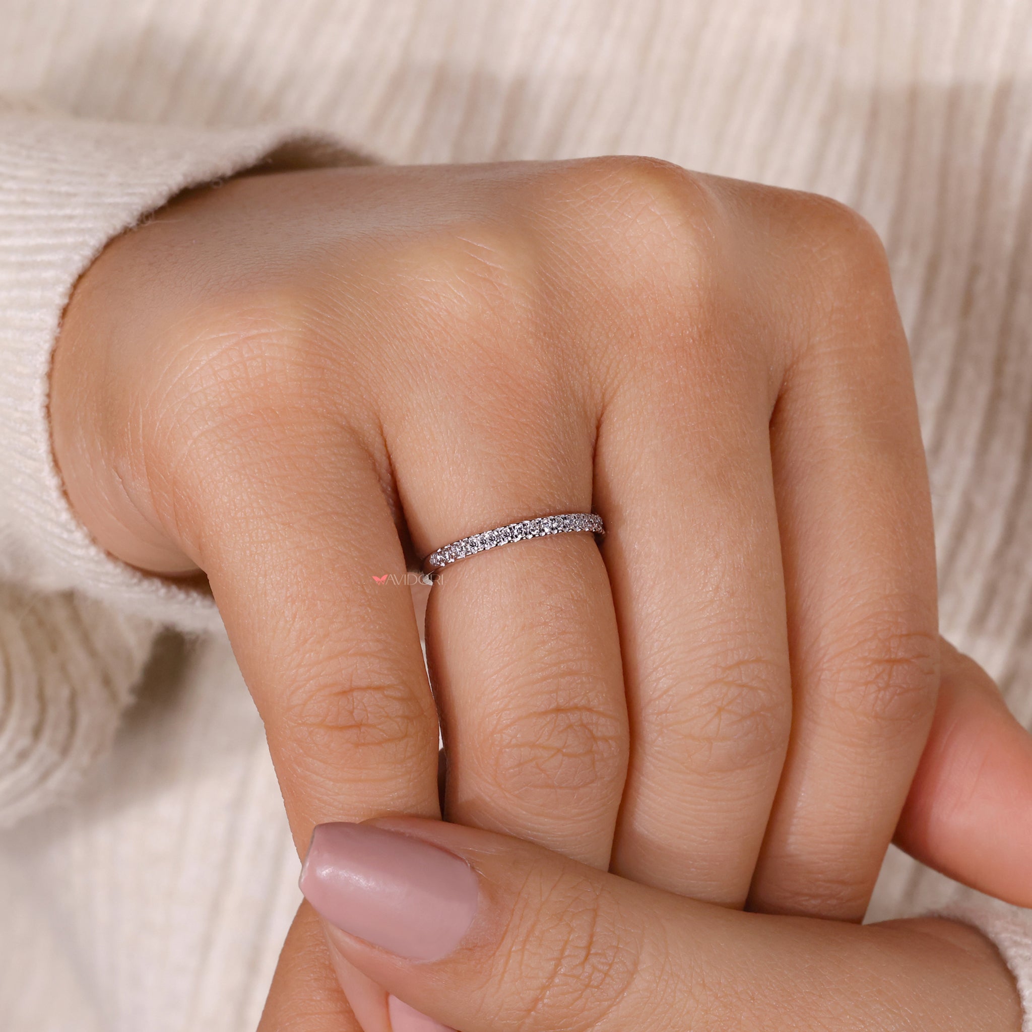 Avideri wedding band showing round diamonds set in classic white gold.
