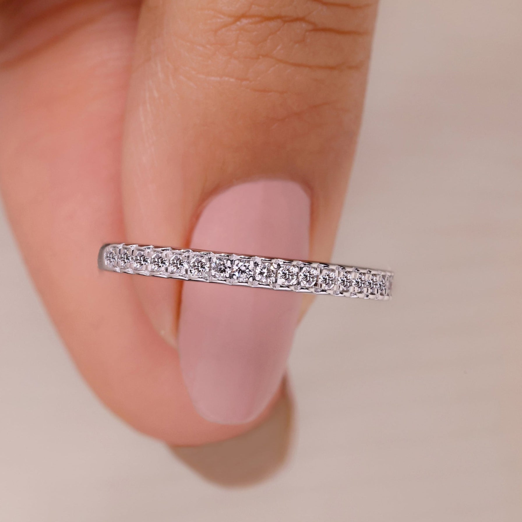 Half eternity wedding band with round cut lab grown diamonds in white gold.
