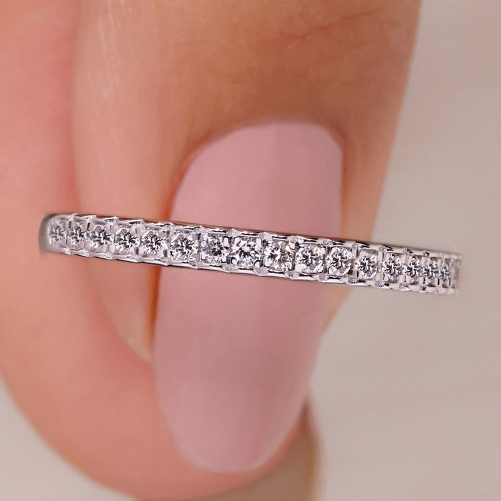 Half eternity wedding band with round cut lab grown diamonds in white gold.
