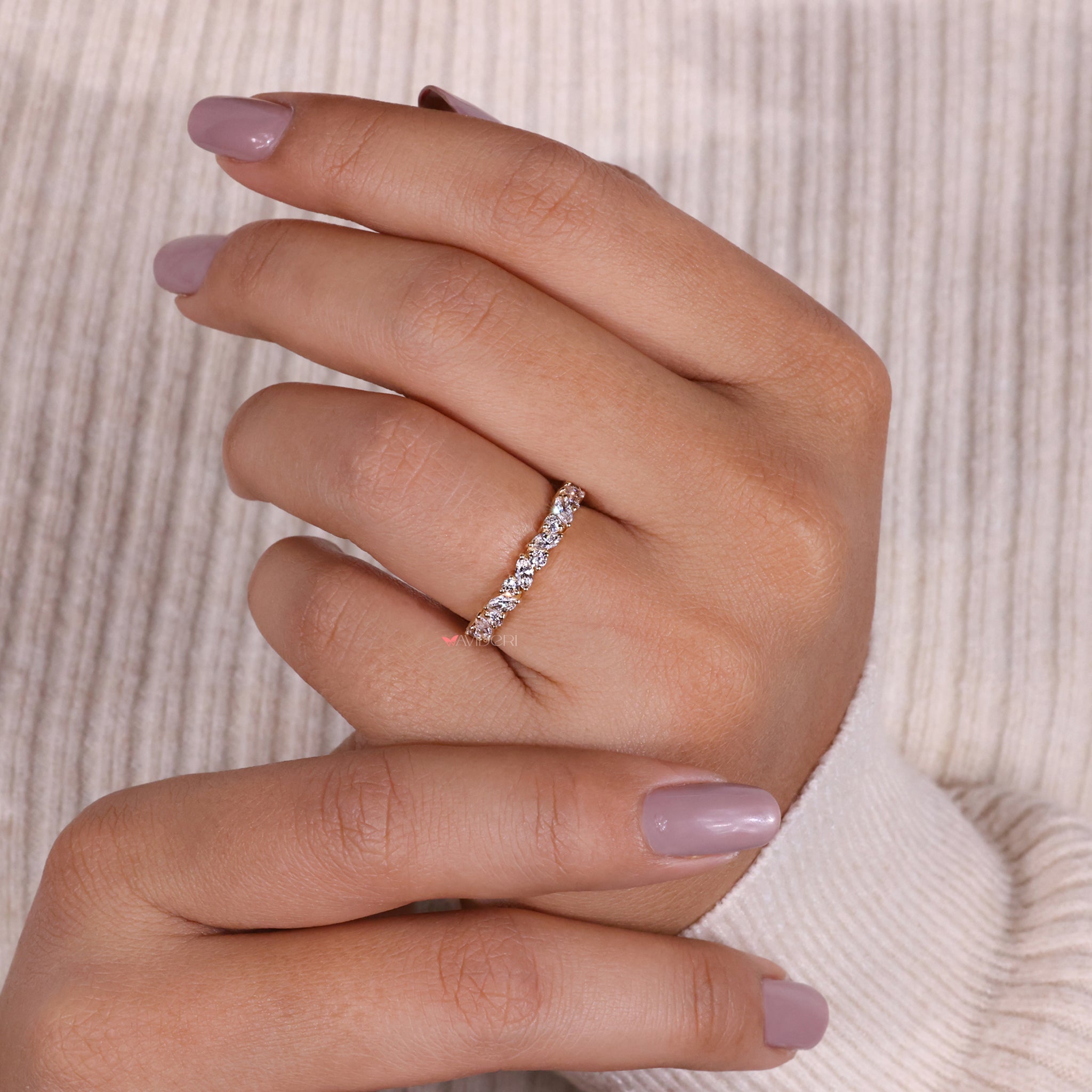 Yellow gold band ring featuring a marquise wedding band for timeless beauty.
