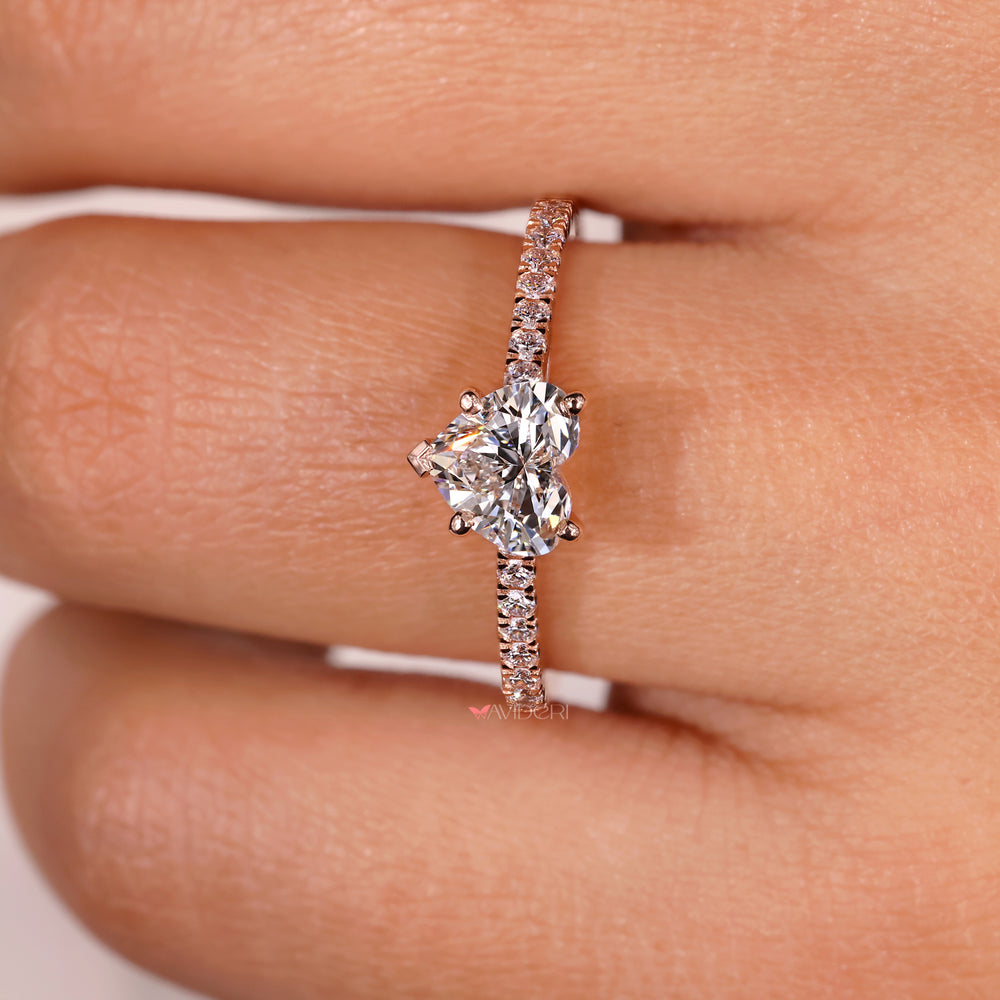 Stunning round diamond ring set in a rose gold band.
