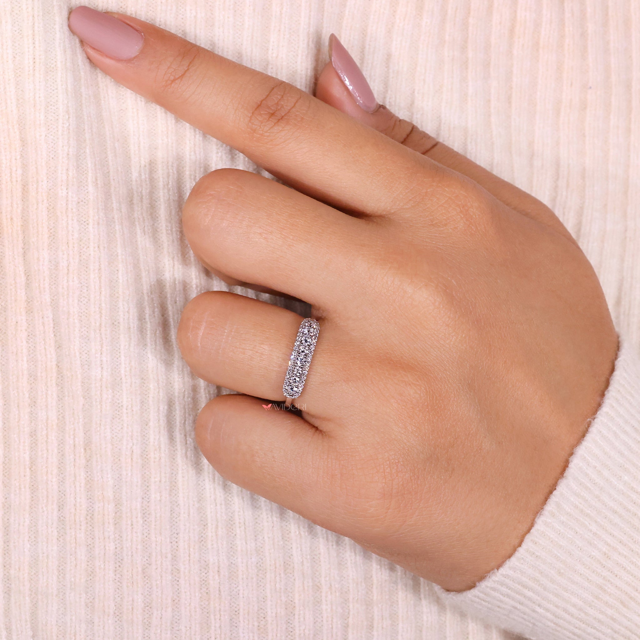 Simple wedding band with timeless round diamonds.
