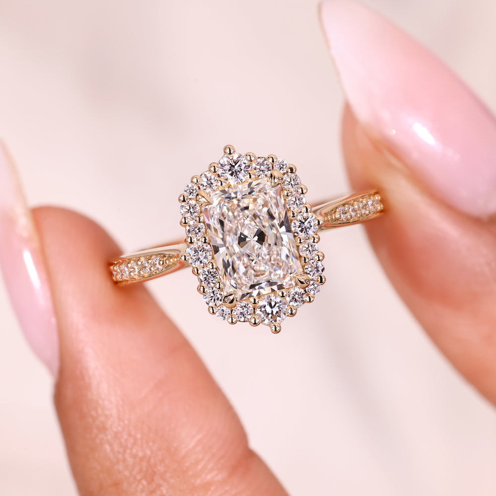 Radiant ring with pave and round diamond accents.
