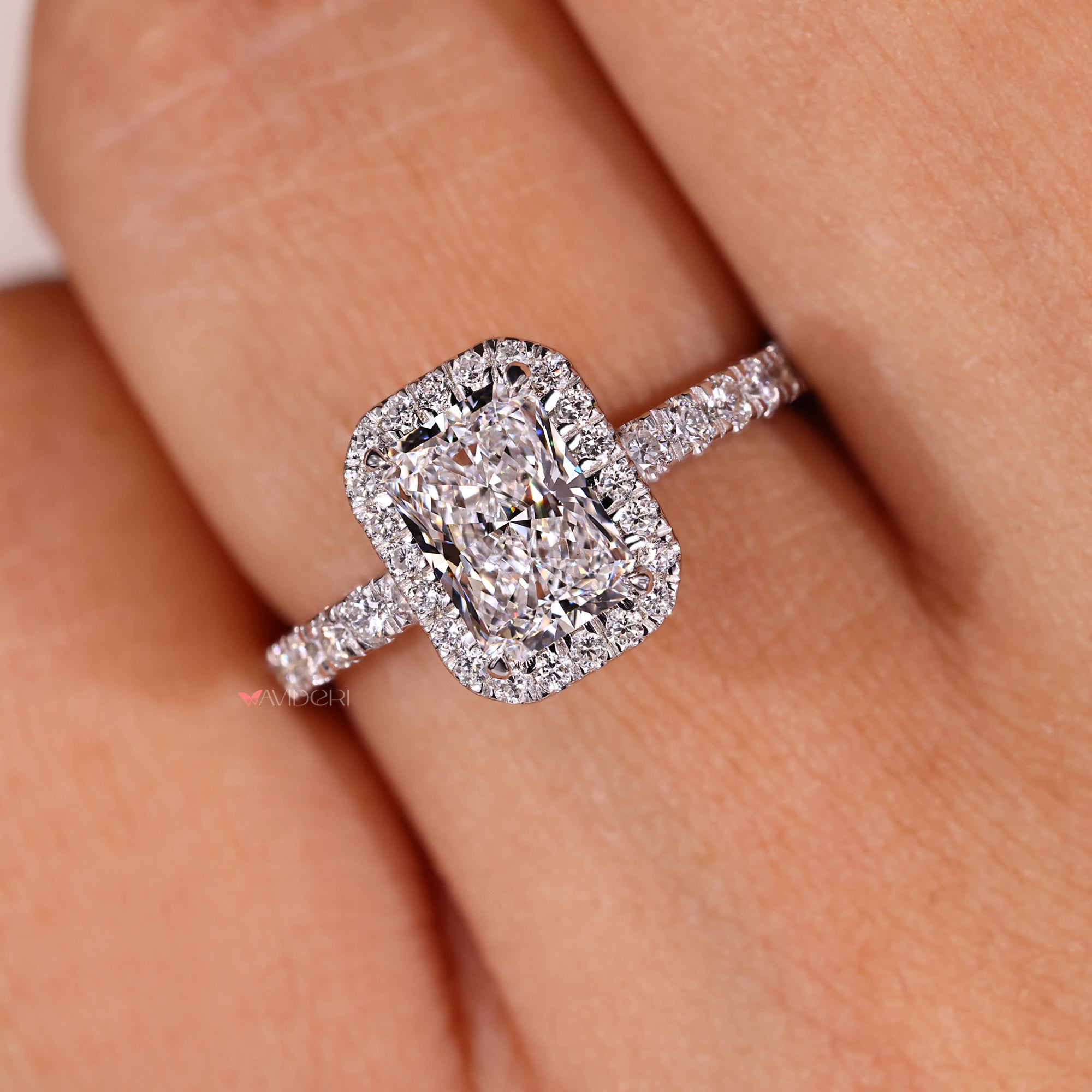 4 claw prong radiant diamond ring with halo design.