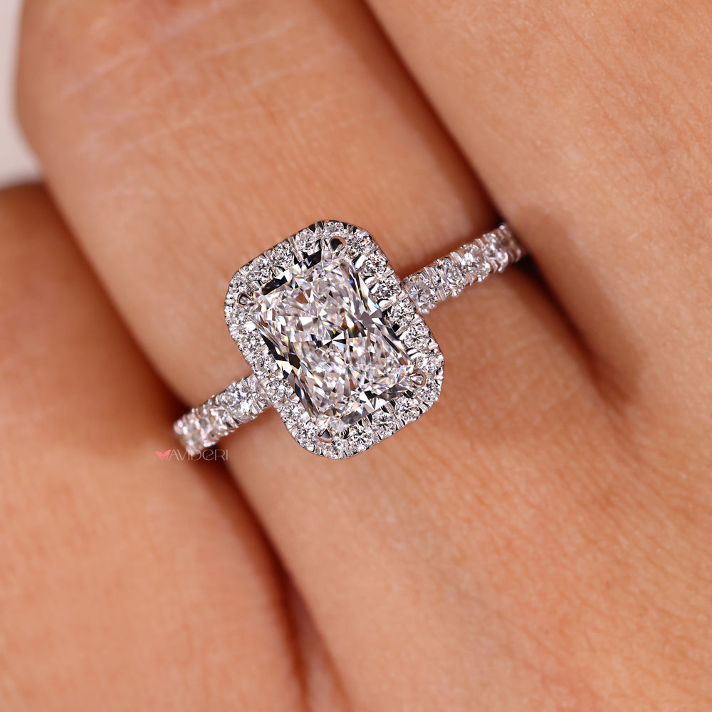 4 claw prong radiant diamond ring with halo design.