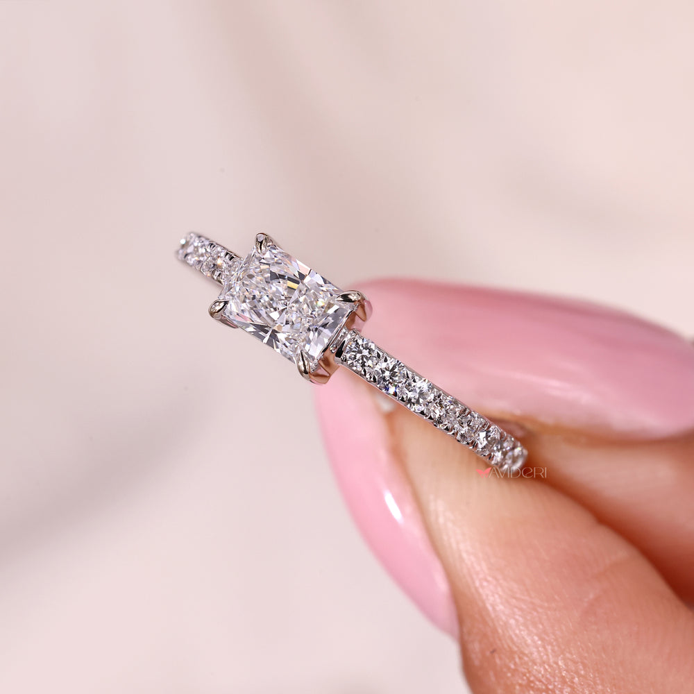 Lab grown radiant cut diamond ring with pave setting.