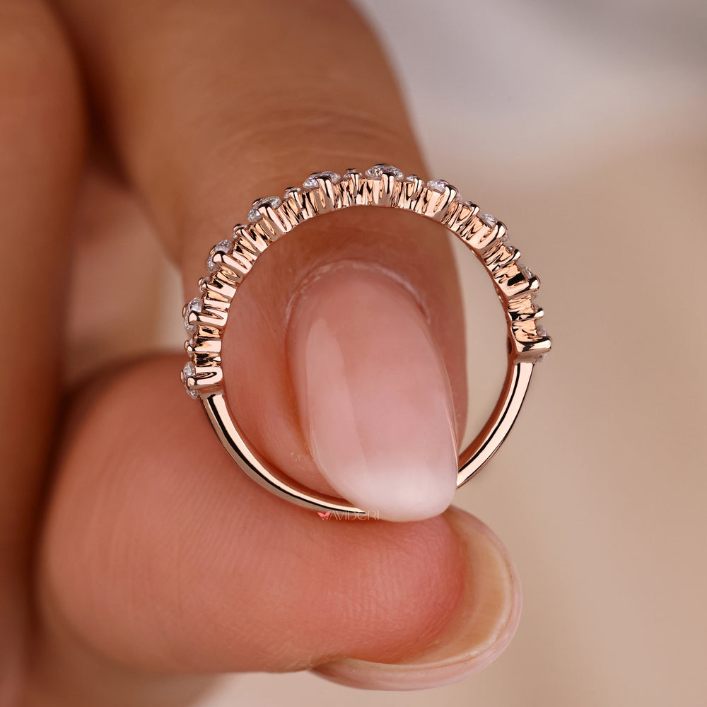 Simple rose gold wedding band with a polished finish.
