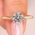 Round cut lab grown diamond ring with bypass setting.

