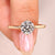 Round cut lab grown diamond ring with bypass setting.

