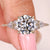 Round cut diamond ring with kite and round side stones
