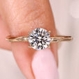 Round cut diamond ring in classic solitaire style.
