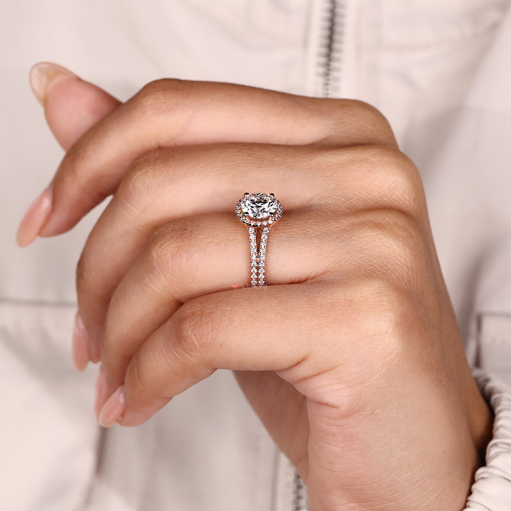 Round diamond ring with split pave band.
