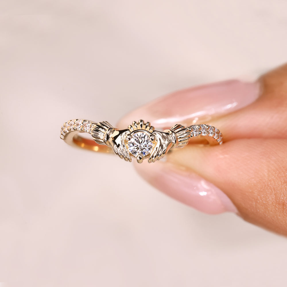 Round cut diamond ring pave claddagh style.
