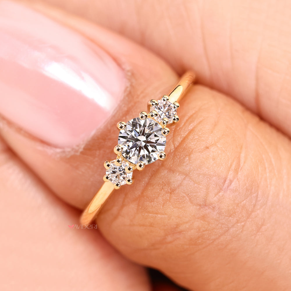 Handmade round ring with three stone design.
