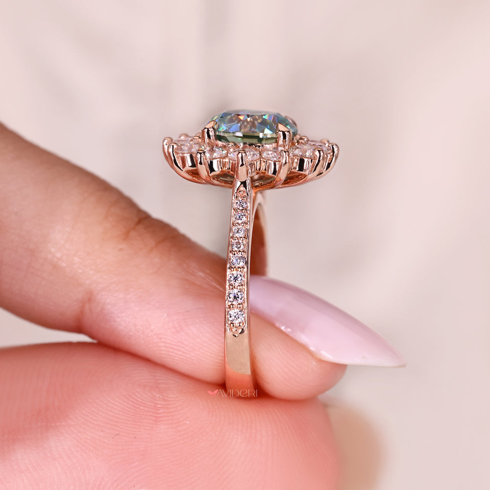 Moissanite ring with cluster and round cut stones.

