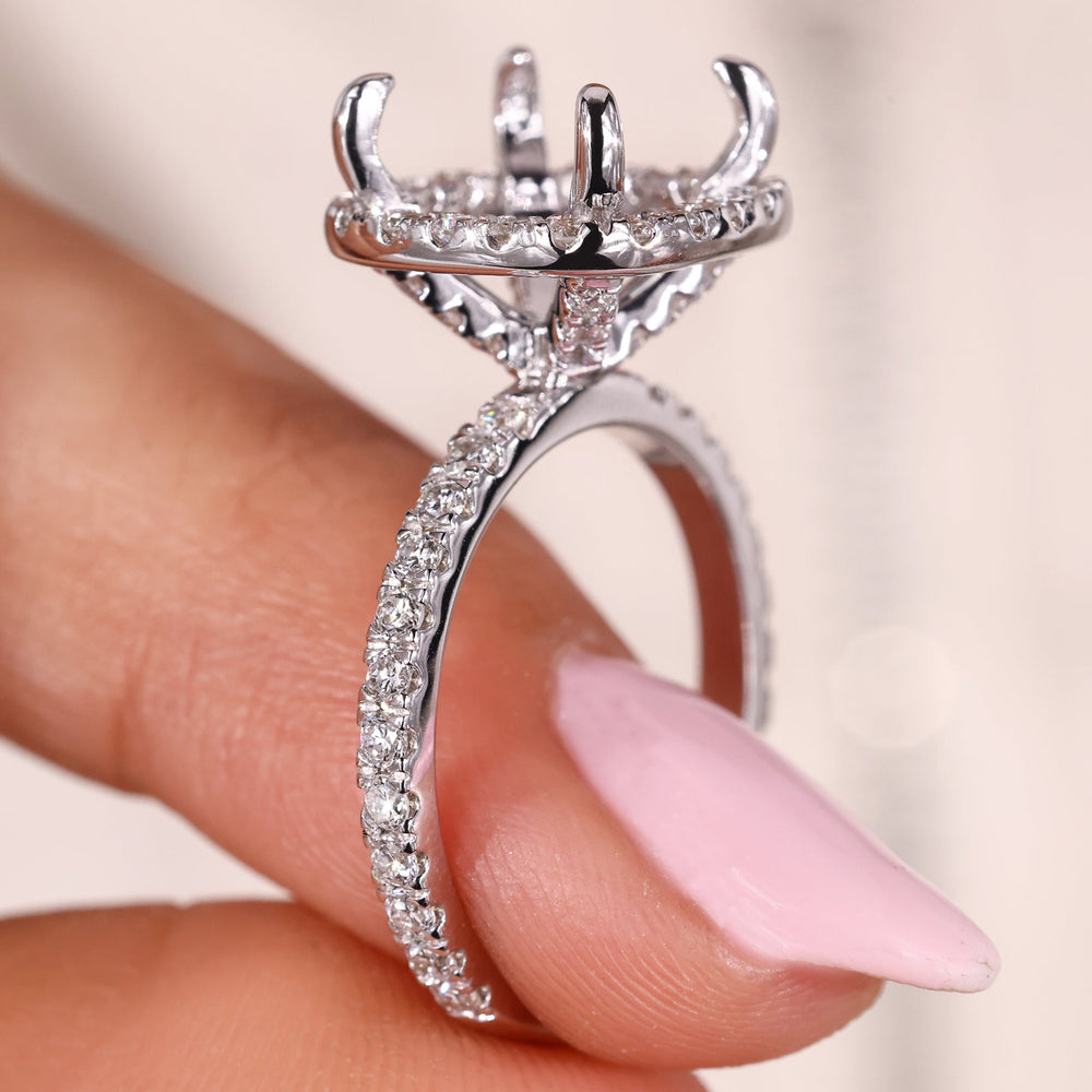 Semi mount engagement ring with pave halo setting.