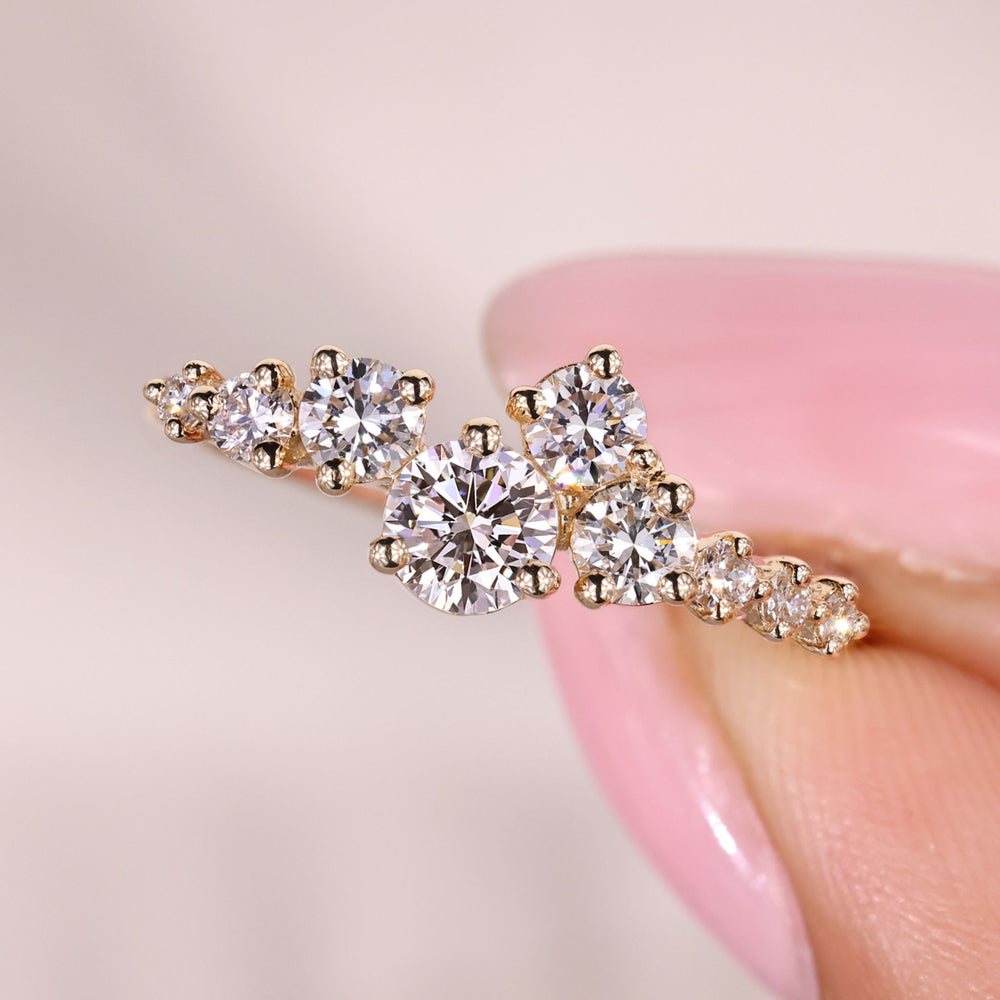 Lab grown round diamond ring with sparkling cluster setting.