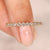 Round diamond wedding band eternity bezel style.
