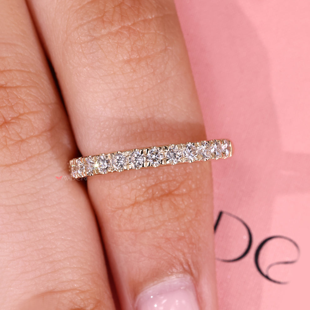 Delicate half eternity diamond band design.
