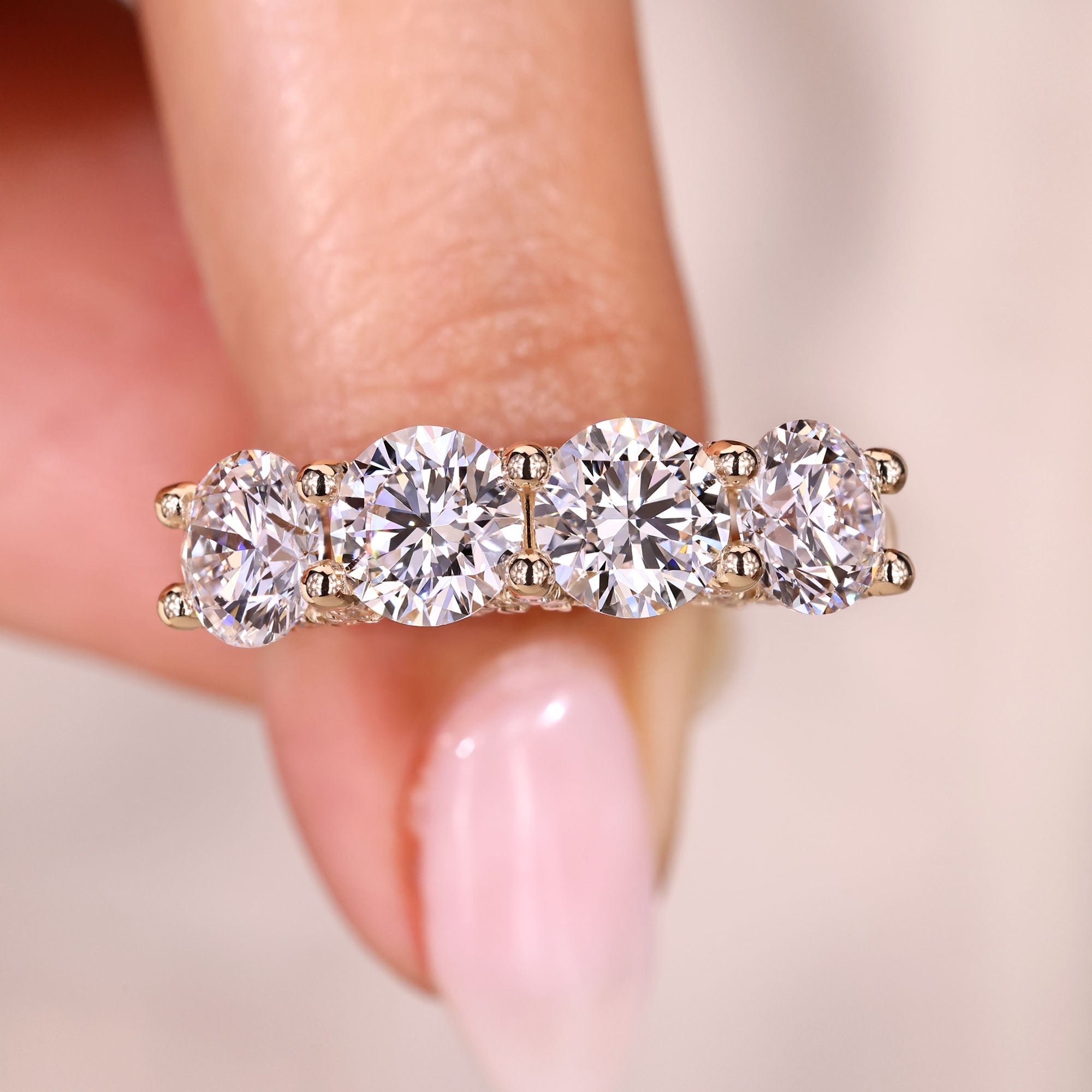 Round diamond wedding band in half eternity style.
