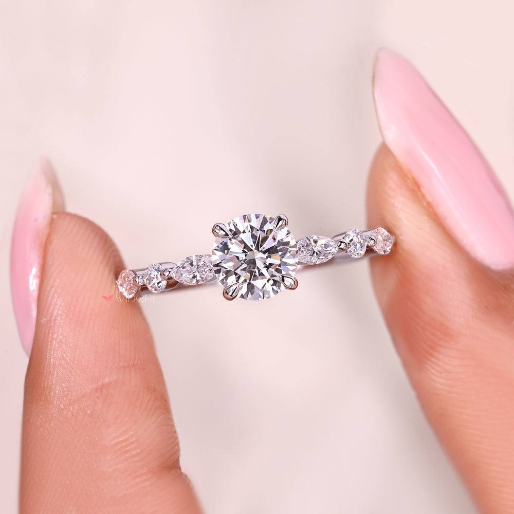 Round diamond ring with shared prong side stone setting.