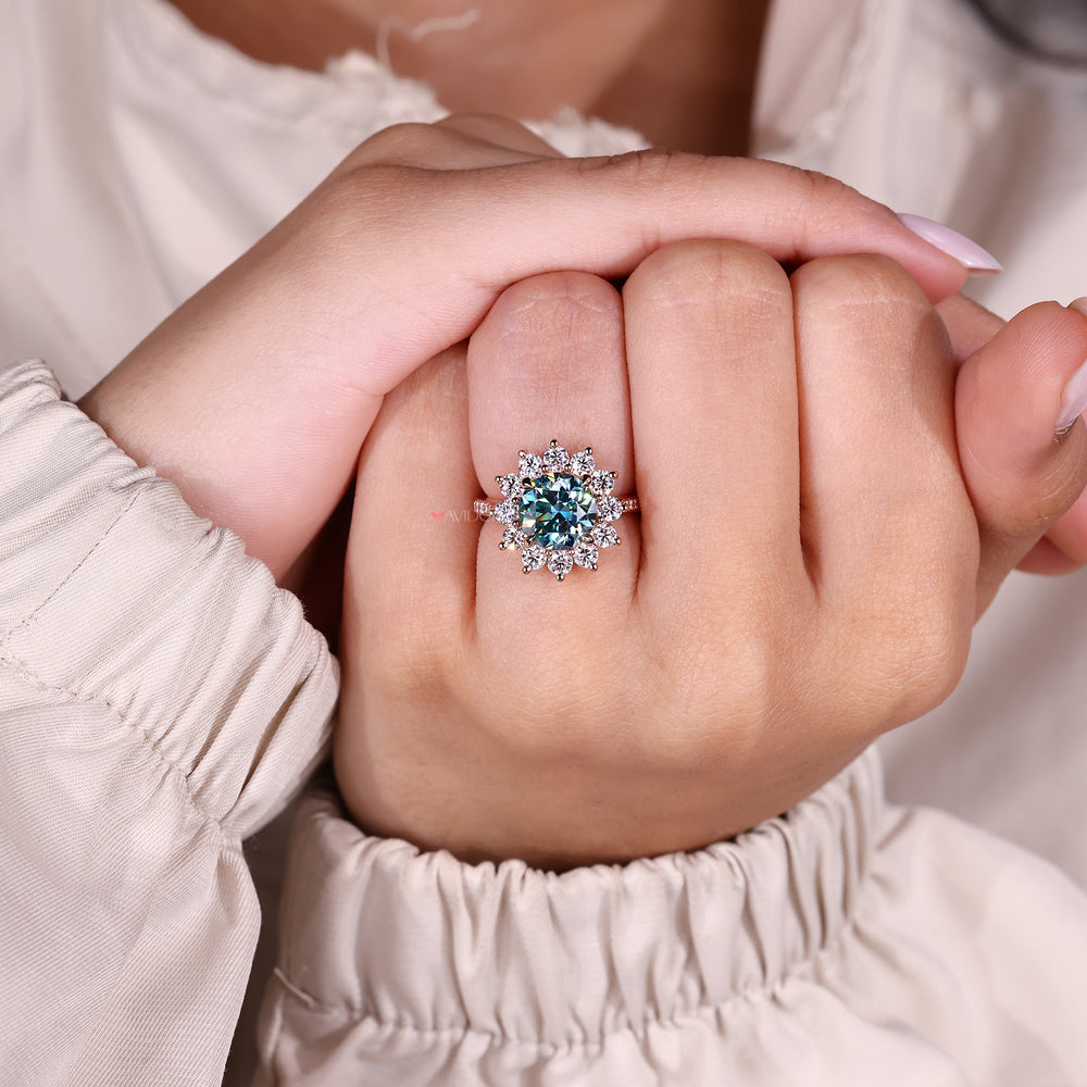 Round cut moissanite ring with cluster design.
