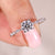Round cut diamond ring in polished white gold.