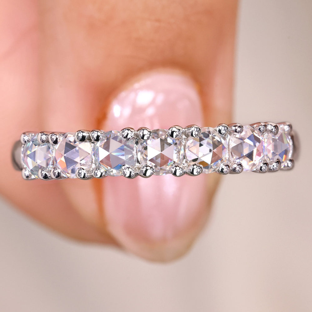 Round rose cut showcases soft brilliance in a delicate and refined style.
