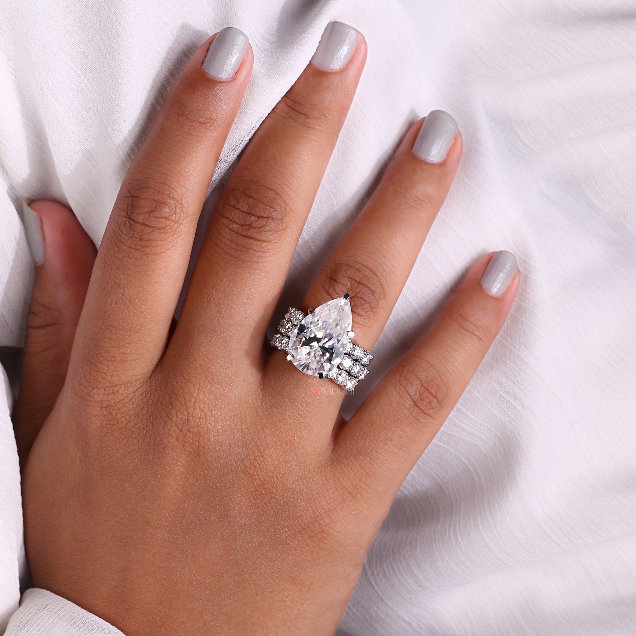 White Gold Bridal Ring Set with pear engagement ring and matching wedding band.