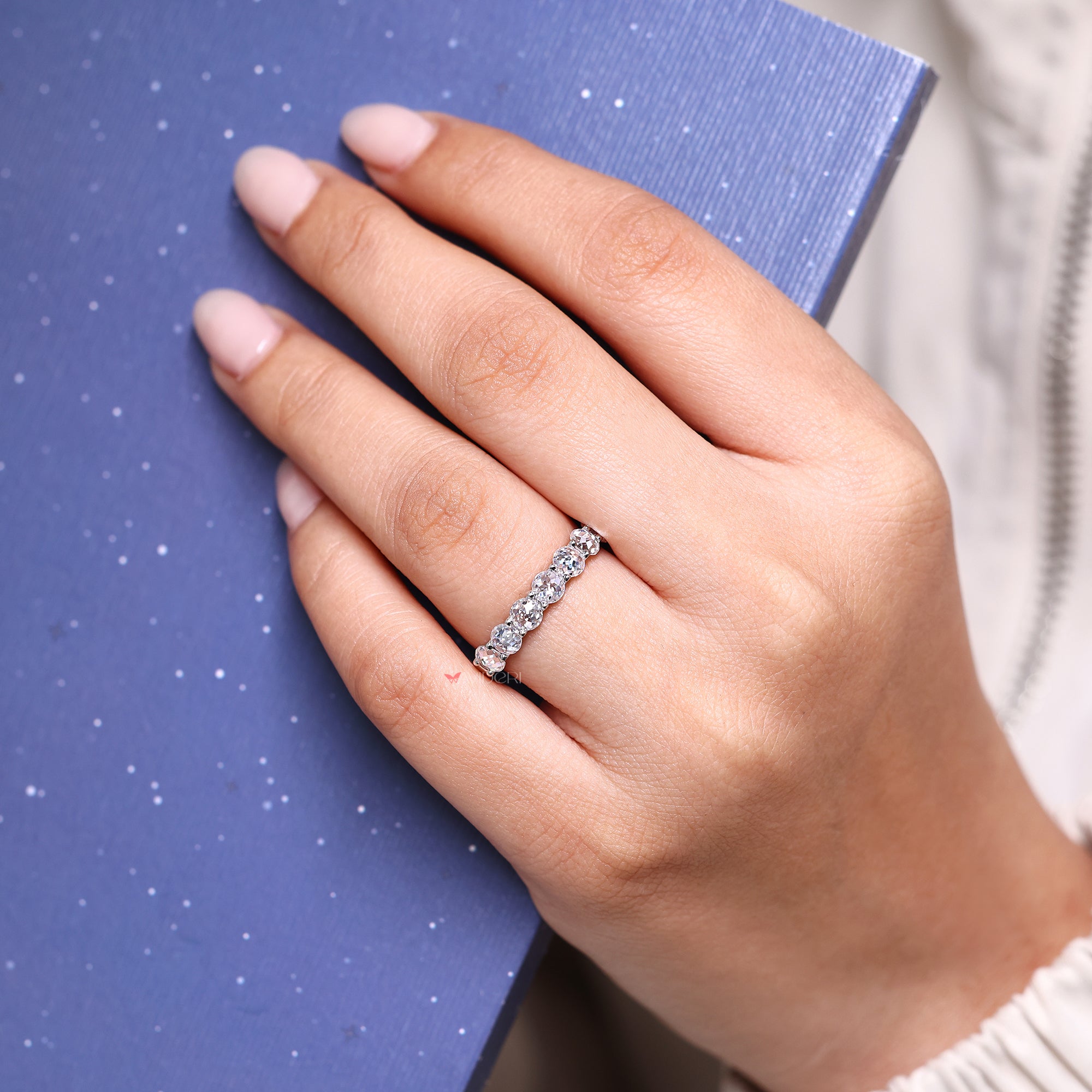 Designer wedding band blends intricate craftsmanship with luxurious styling.