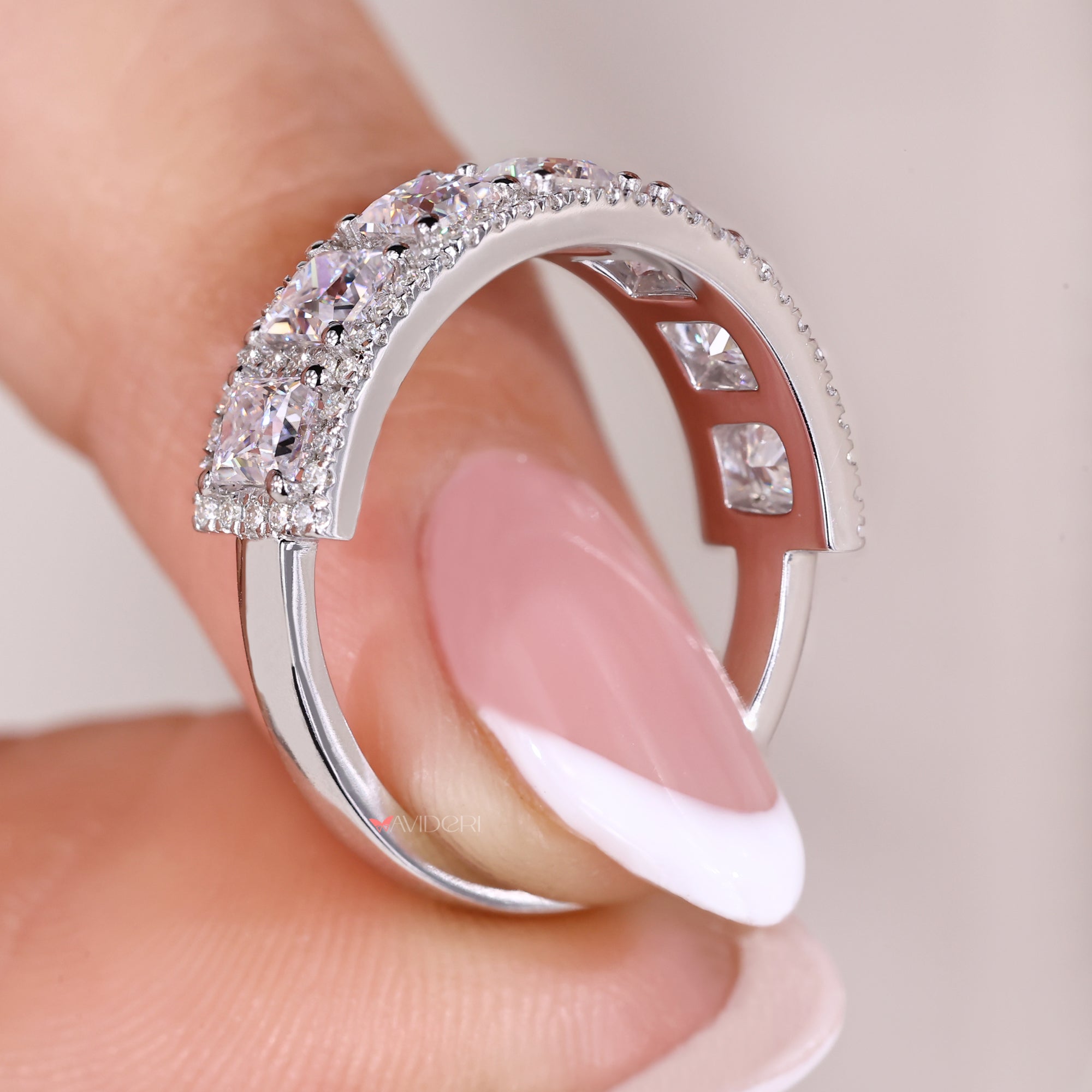 Half eternity Moissanite wedding band in white gold.