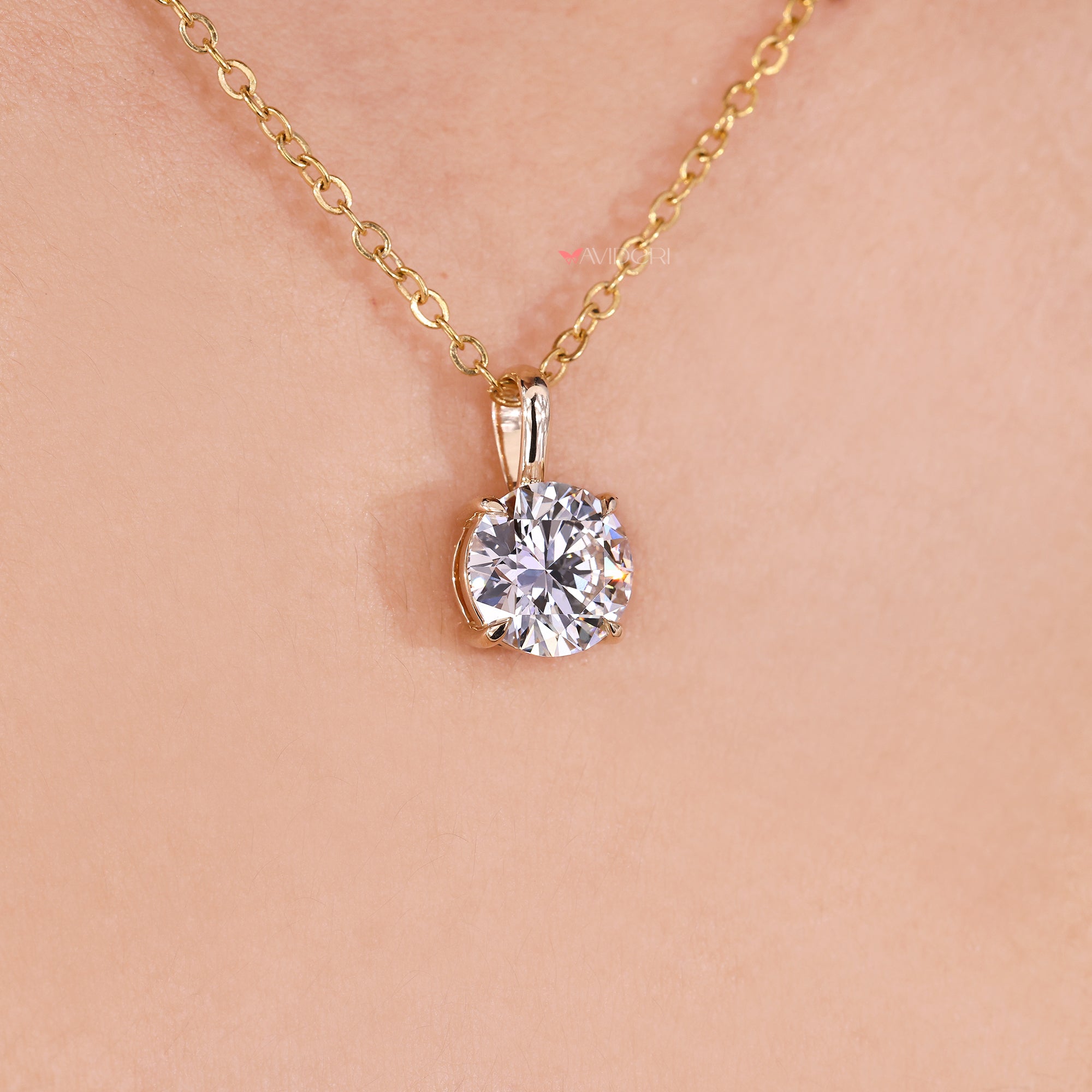 Lab grown round cut diamond pendant in solitaire design.