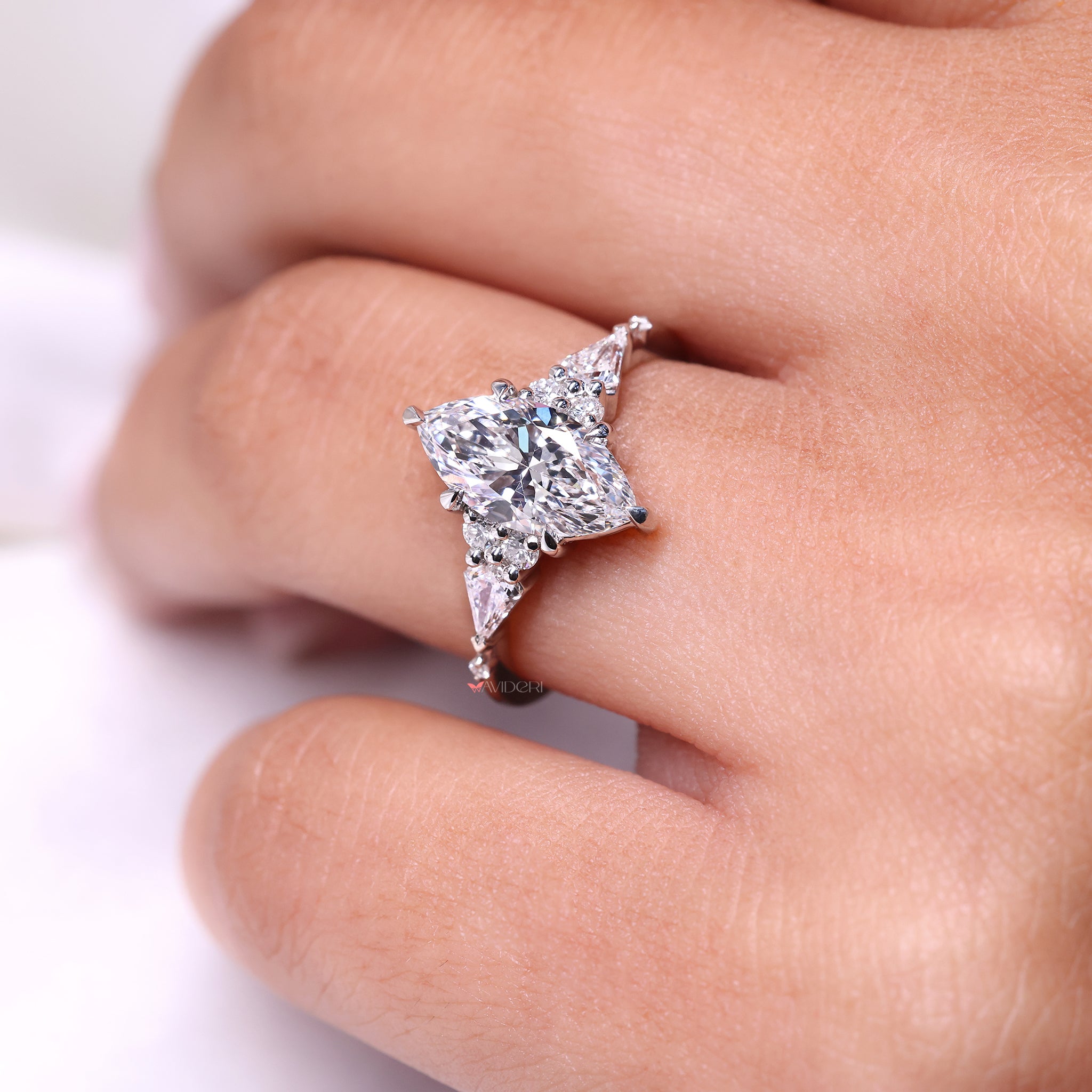 Muse set ring highlights center stone with clean, elegant structure.