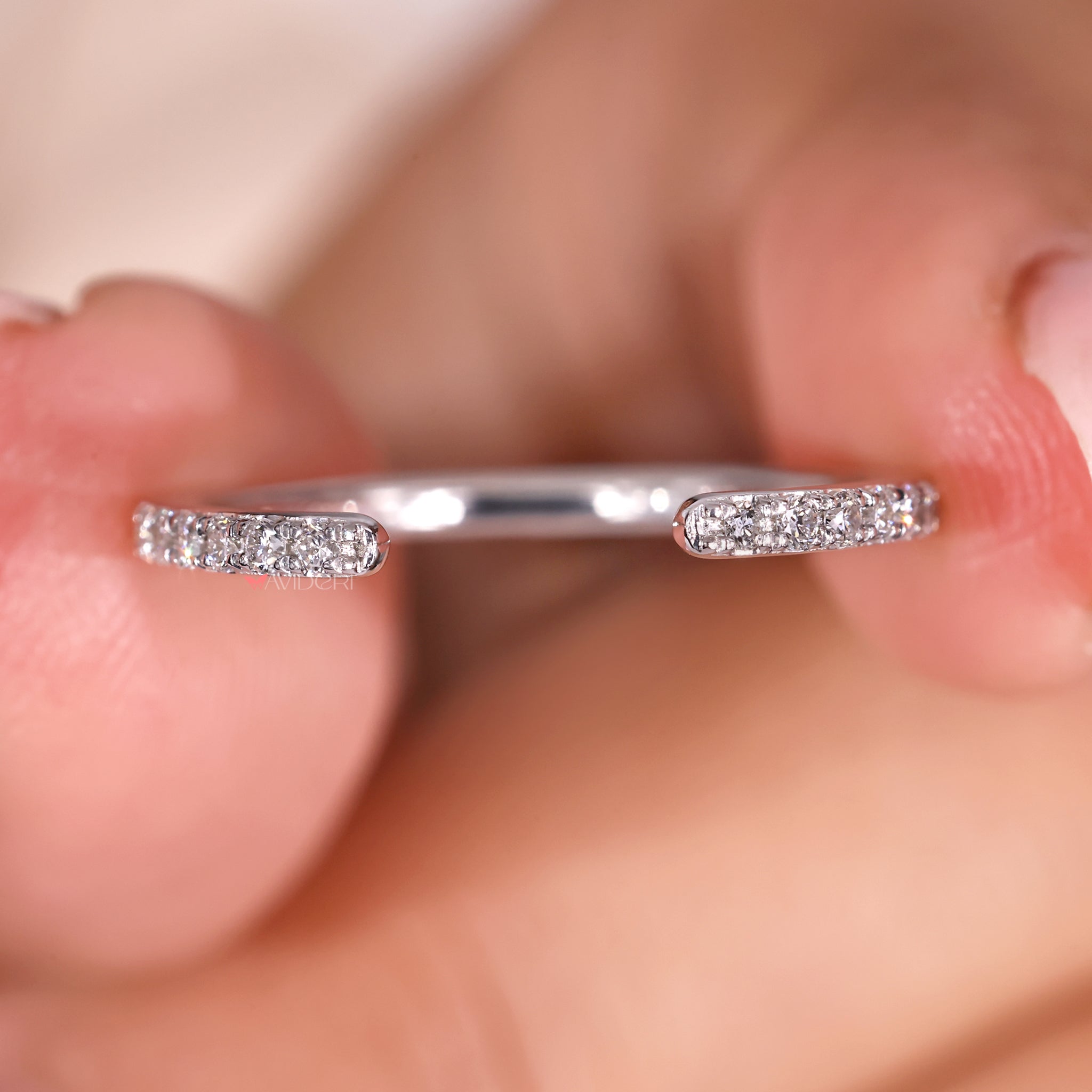 IGI certified wedding band with prong setting.