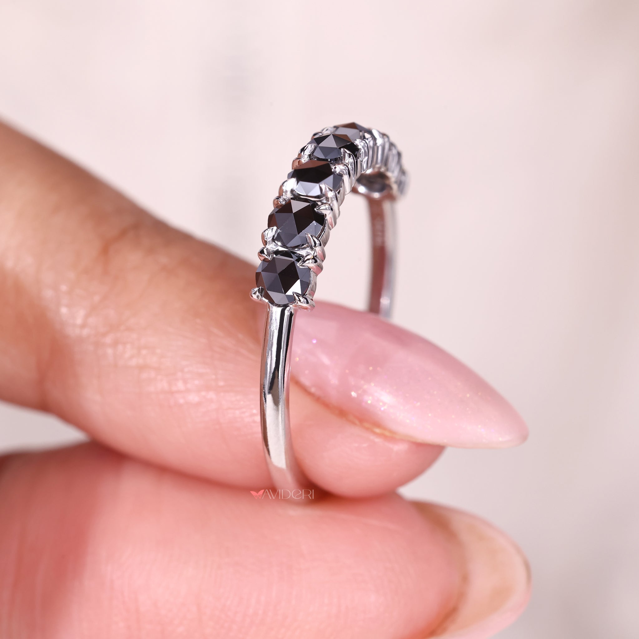 A moissanite white gold band combines brilliance with elegance.