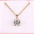 Round solitaire pendant with four claw prong setting in yellow gold.