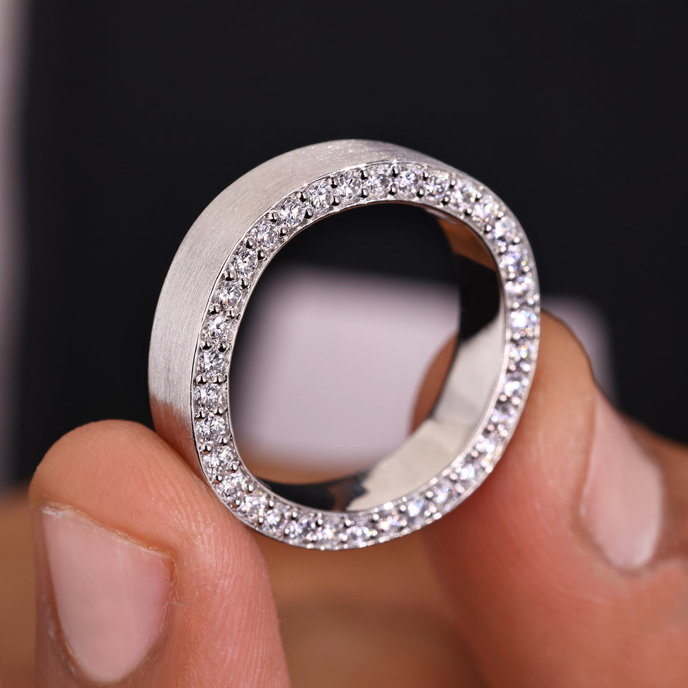 Mens pave wedding band creates a bold statement.