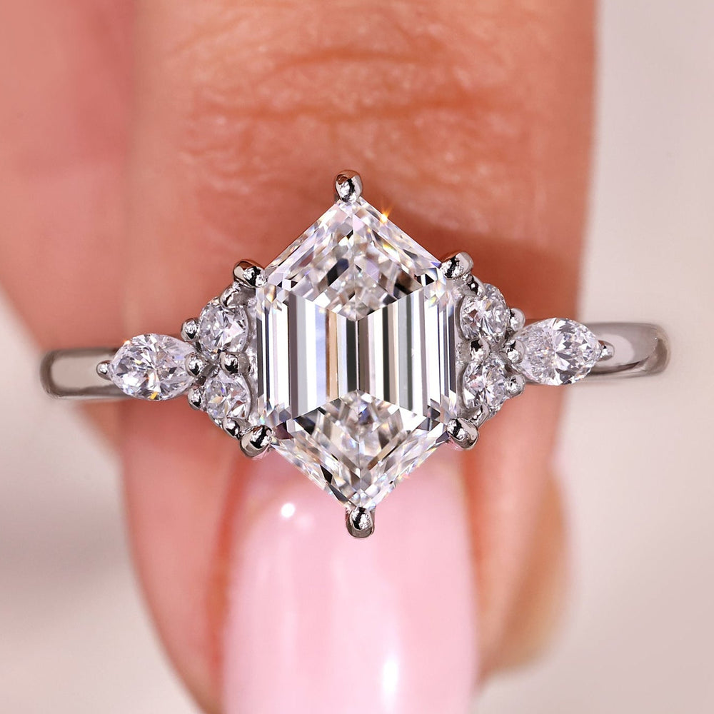 Seven stone diamond ring with hexagon step cut center diamond.