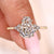 Seven stone diamond ring with coffin cut center stone.