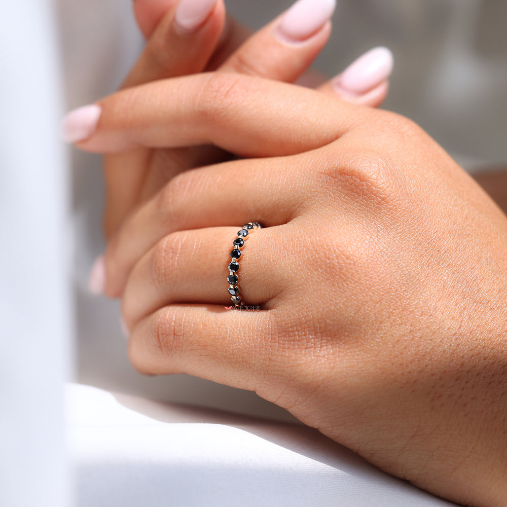 A round and marquise wedding band combines two classic shapes.