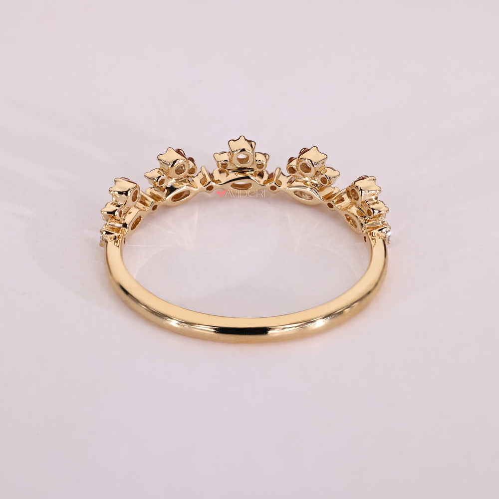 Marquise diamond cut wedding band in yellow gold with a tapered shank design.
