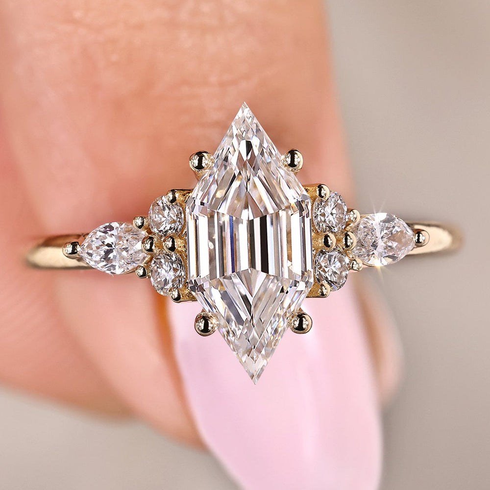 Hexagon step cut diamond ring with marquise side stones
