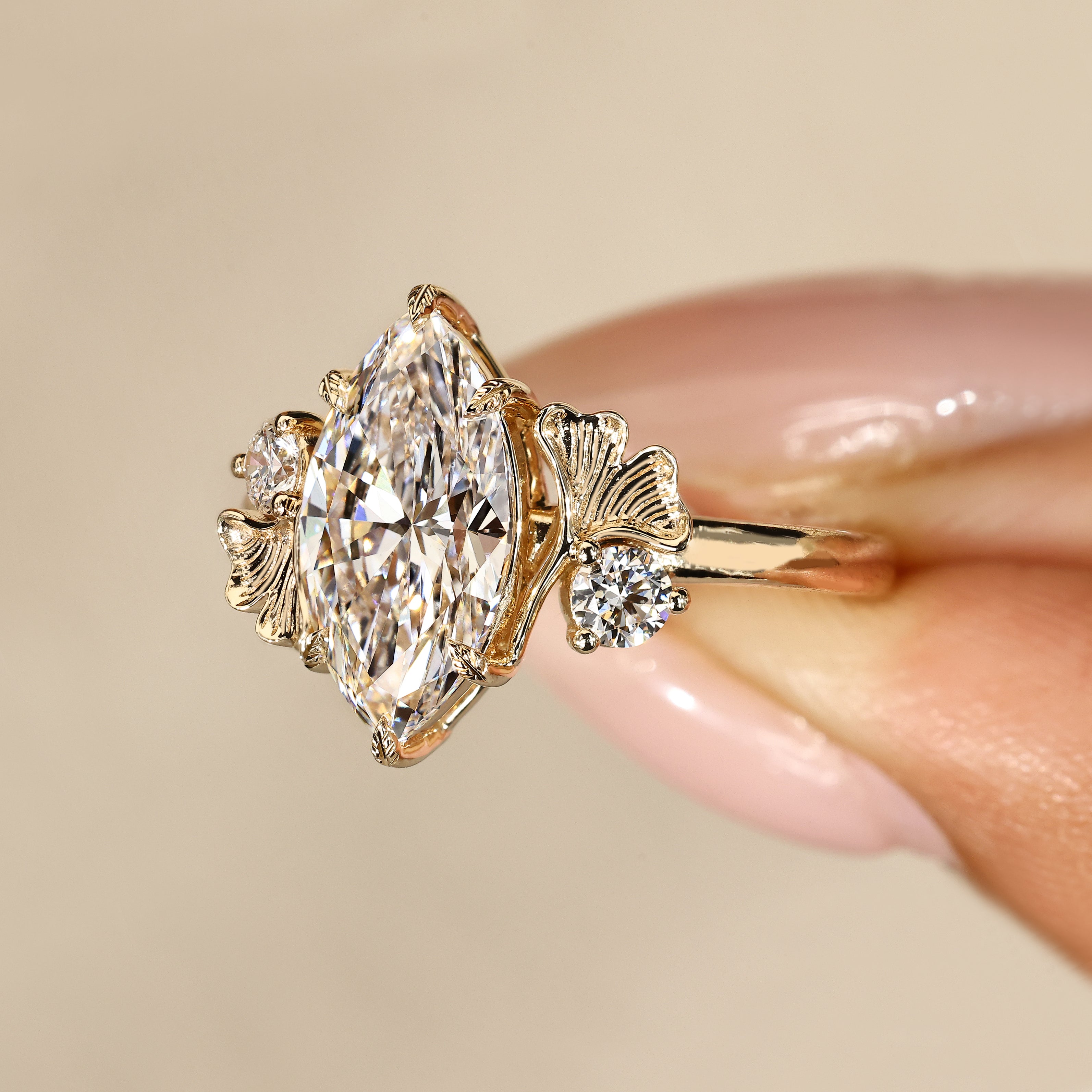 Handmade marquise diamond ring with leaf prongs.
