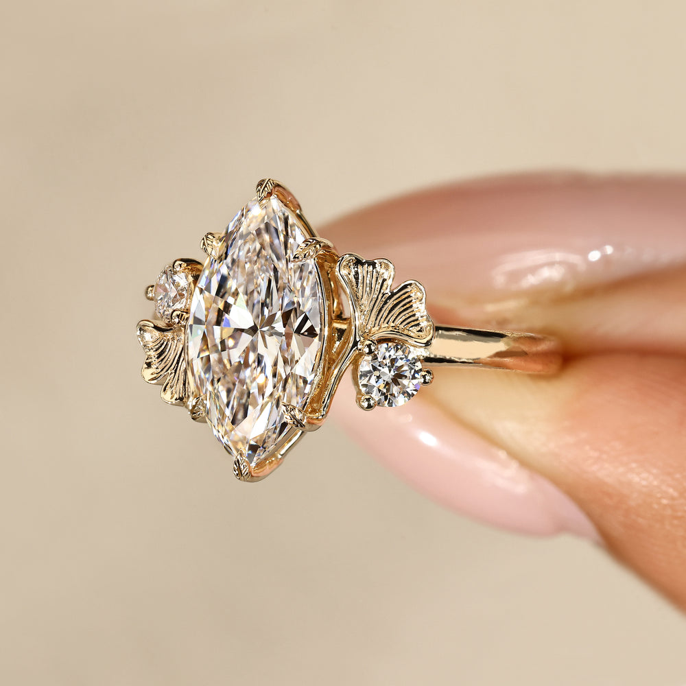 Handmade marquise diamond ring with leaf prongs.
