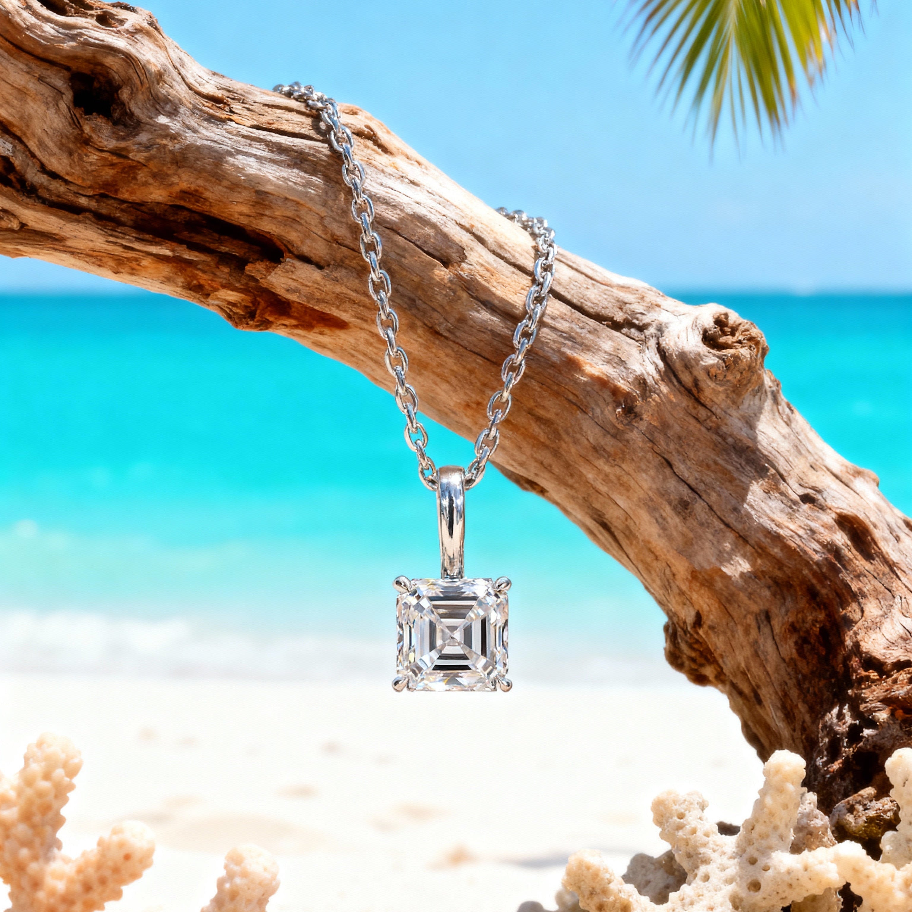 Diamond necklace on a branch with a tropical beach background