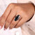 Six prong ring featuring a brilliant moissanite center stone.
