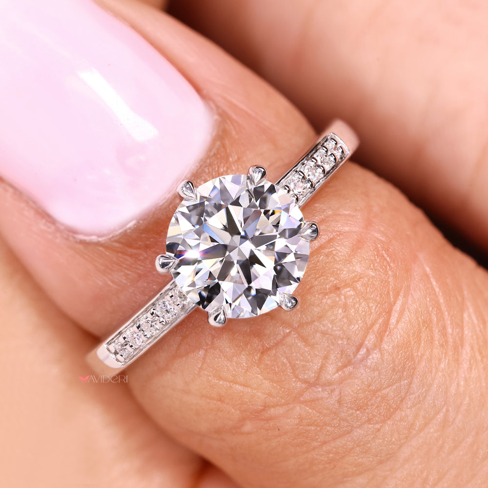 Round cut diamond ring with secure six claw prongs

